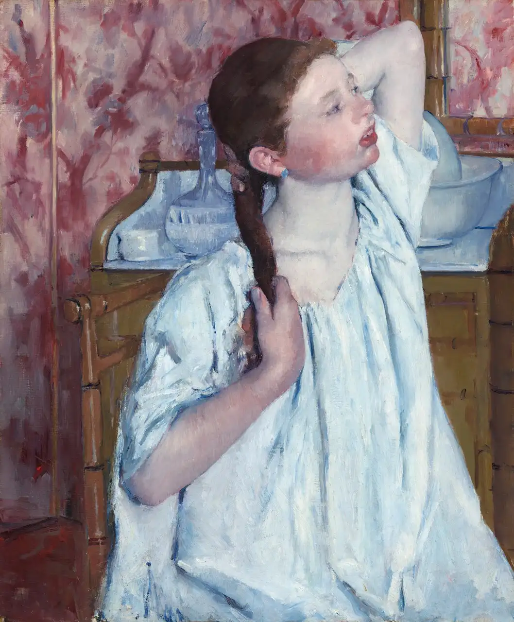 Girl Arranging Her Hair by Mary Cassatt